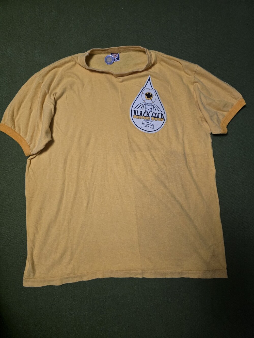 Vintage 70's yellow ringer t-shirt features a distinctive "Black Gold" oil drop